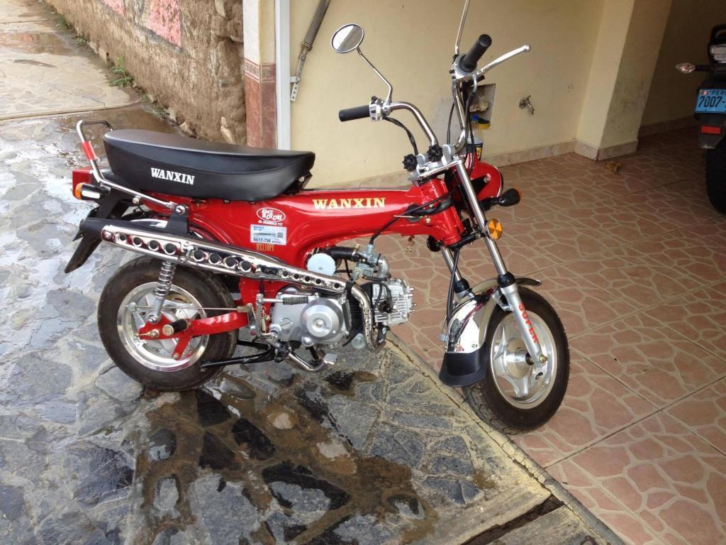 se vende una moto wanxin ,motor 110 ,color rojo,año 2015